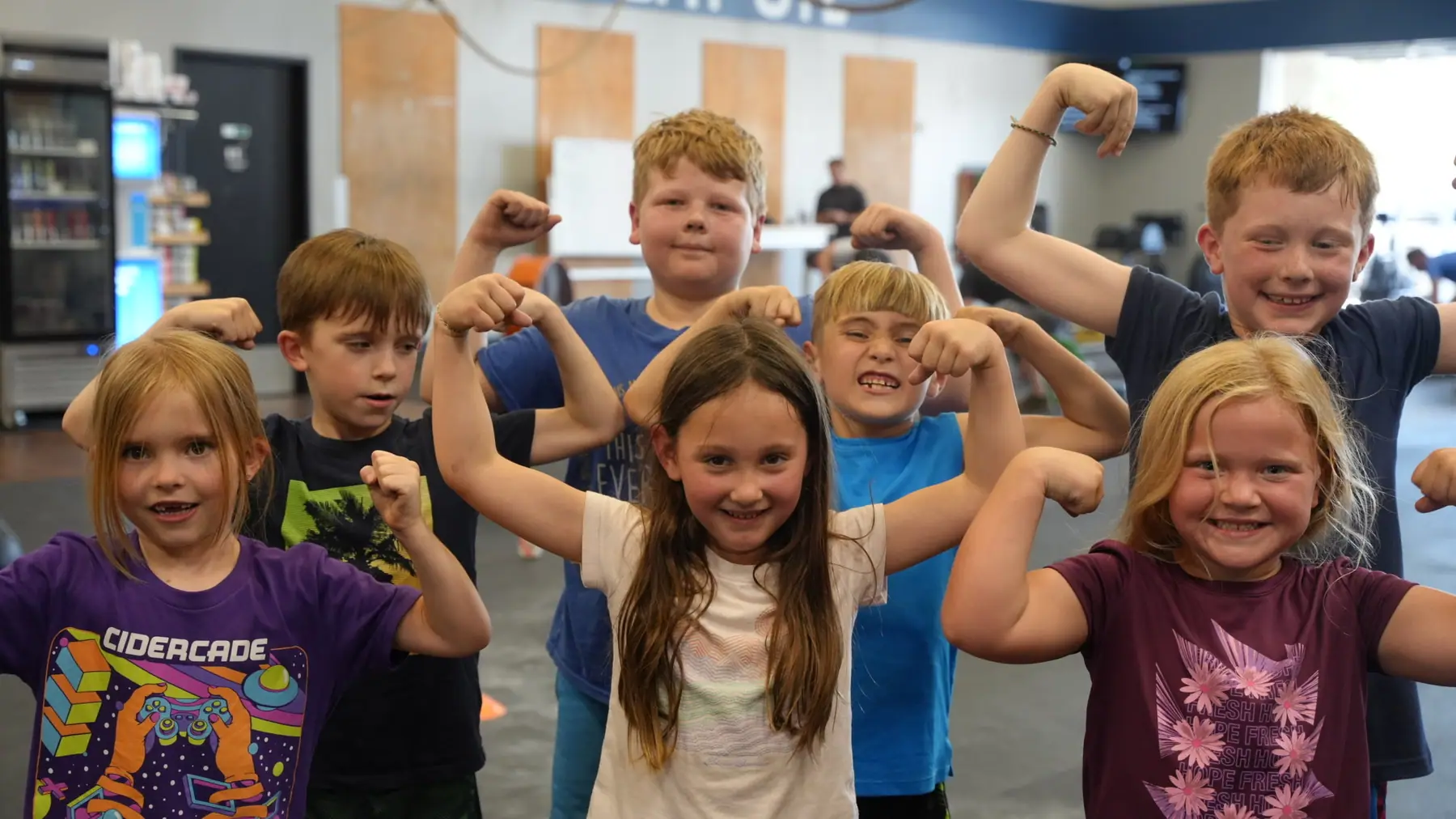 Kids flexing after their class at CrossFit OTL